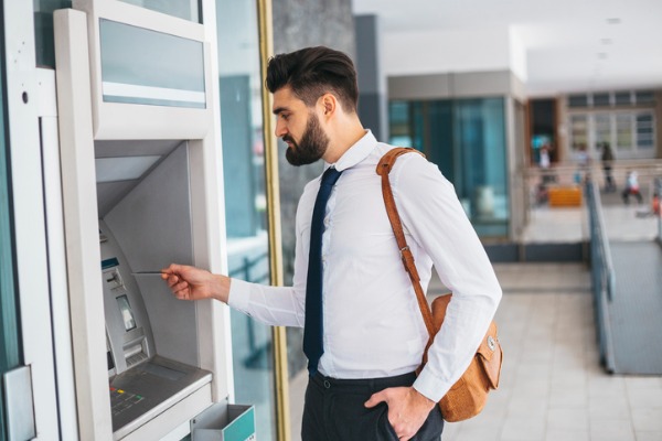 Man using ATM machine